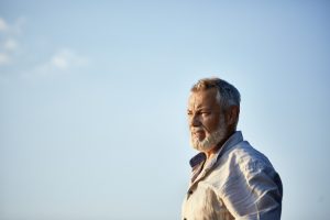 Portrait of a serious senior man outdoors