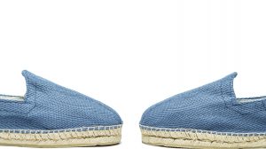 PAIR OF ELEGANT AND STYLISH BLUE ESPADRILLES FACE TO FACE.SUMMER FOOTWEAR FASHION CONCEPT.WHITE BACKGROUND.
