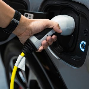 Hand charging modern electric car