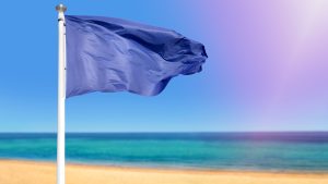 blue flag at a spanish beach