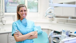 Cheerful female dentist in office