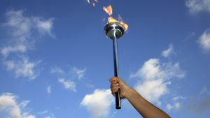glory of holding flaming torch