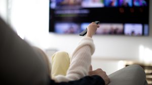 Family watching TV at home