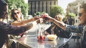 Tourist woman drinking cocktails in Madrid