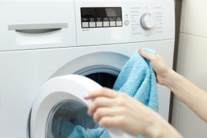 Woman loading laundry